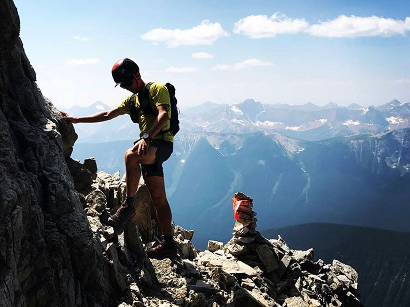 Adam Campbell rock climbing