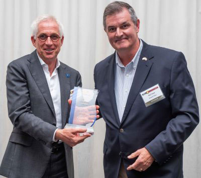 Javier Benedicto, left, accept the Satellites Leadership Award on behalf of Giuliano Gatti of the European Space Agency, from Phil Froom of Rockwell Collins. (Photo: Melanie Beus)