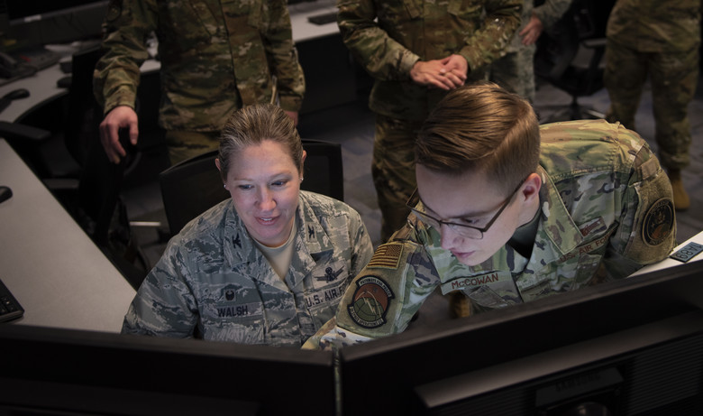 From left, Col. Laurel Walsh, 50th Operations Group commander, and Airman 1st Class Michael McCowan, 2nd Space Operations Squadron satellite systems operator and mission planner, give the final command to decommission Satellite Vehicle Number-36 at Schriever Air Force Base, Colorado, Jan. 27, 2020. SVN-36 was launched March 10, 1994, and exceeded its design life of approximately seven years. (U.S. Air Force photo by Airman Amanda Lovelace)