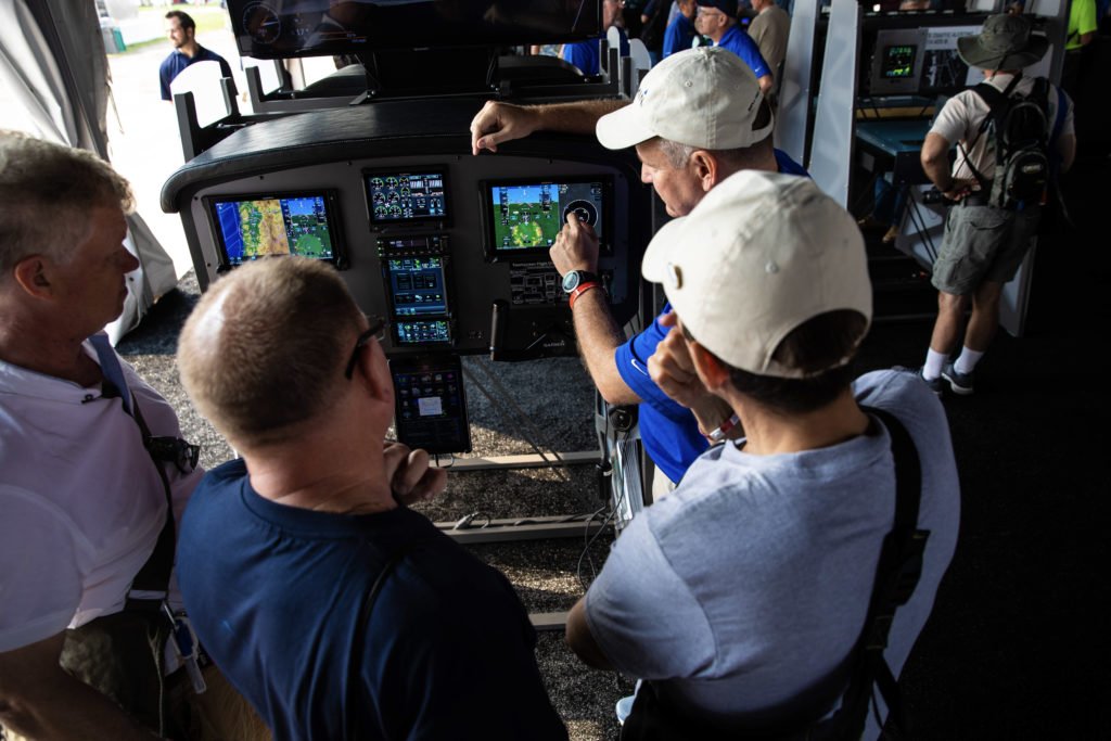 Customers getting a demonstration of Garmin avionics