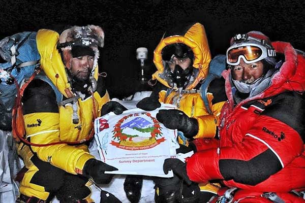 On the summit: Chief Officer Khim Lal Gautam, Survey Officer Rabin Karki, Sherpa Tshiring Jangbu, and the Trimble R10. (Photo: Trimble)