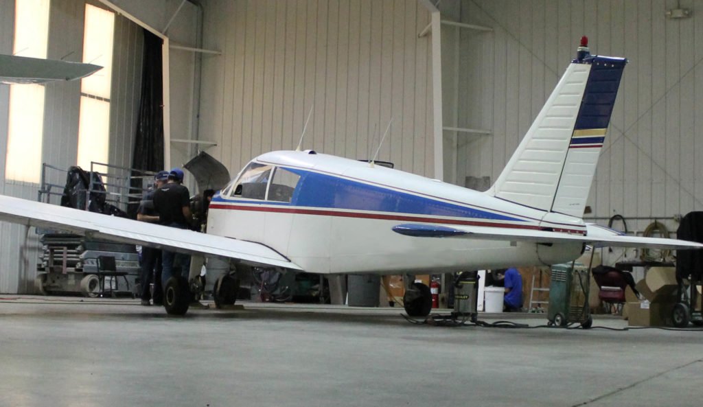 Piper Cherokee aircraft in hangar