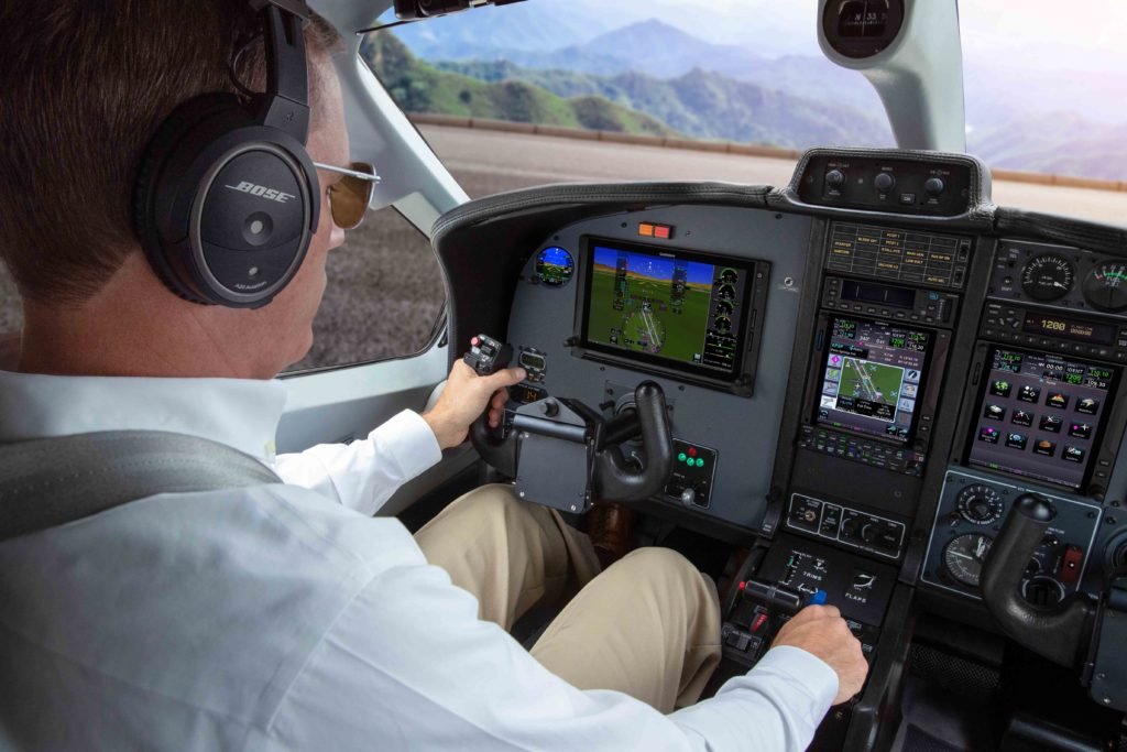 Pilot in the cockpit of an aircraft preparing to takeoff.