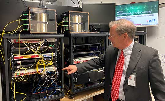 Monty Johnson of OPNT demonstrates precise time transfer through 100 kilometers of spooled fiber-optic cable. (Photo: RNT Foundation)