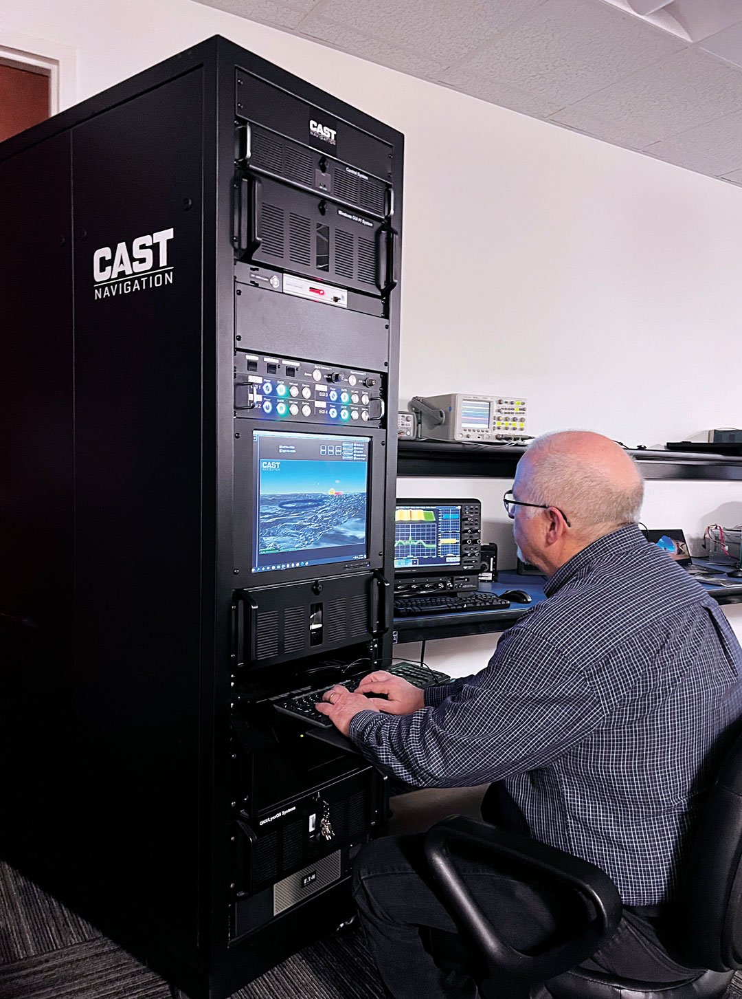 senior software engineer Neil O’Brien utilizing a CAST-8000 GNSS simulator to analyze CRPA trajectory data. (Photo: CAST Navigation) 