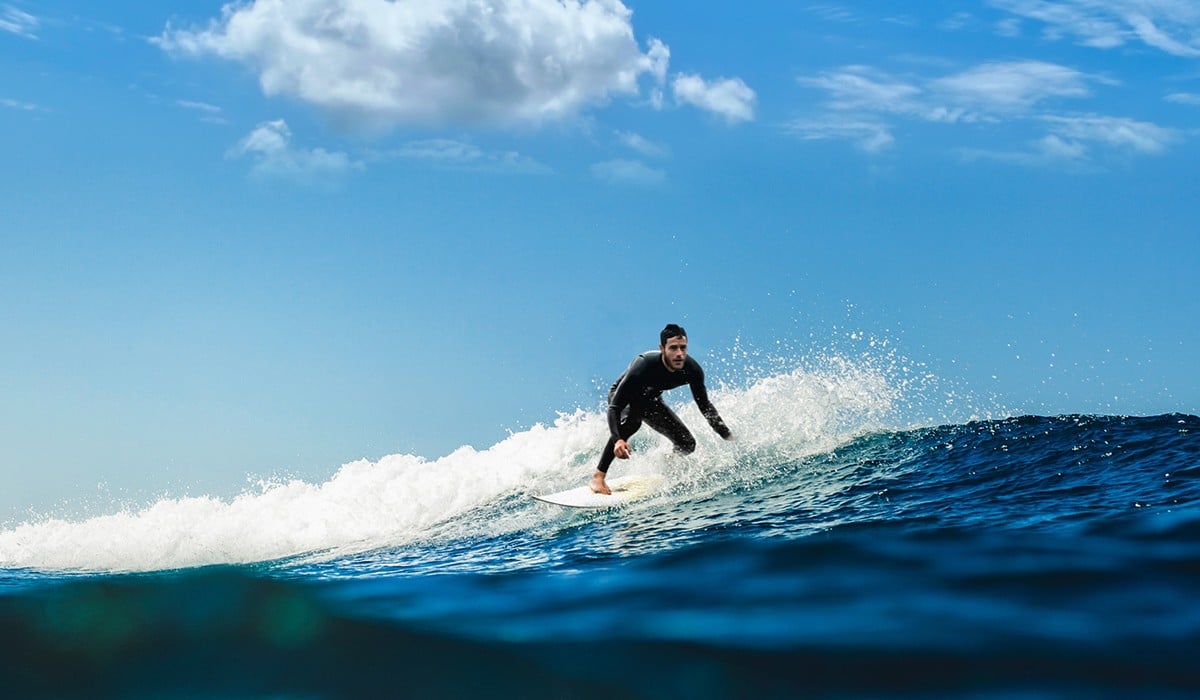 Man surfing a small wave.