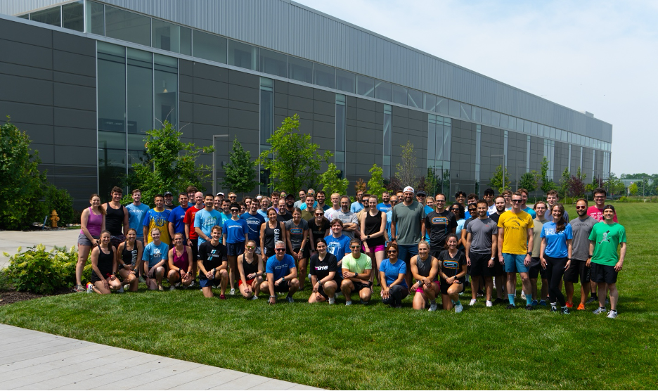 Garmin associates lined up in front of Olathe office for Global Running Day.