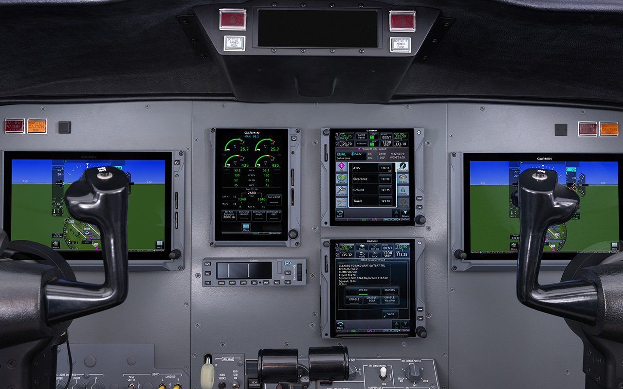 A Garmin integrated flight deck sits at the ready inside a cockpit, which features Garmin's FAA Data Comm.