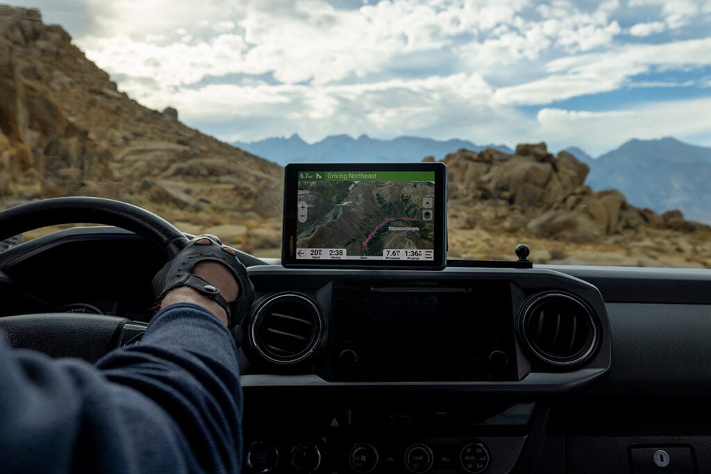 The Tread 2 GPS navigator is displayed on a vehicle's dashboard.