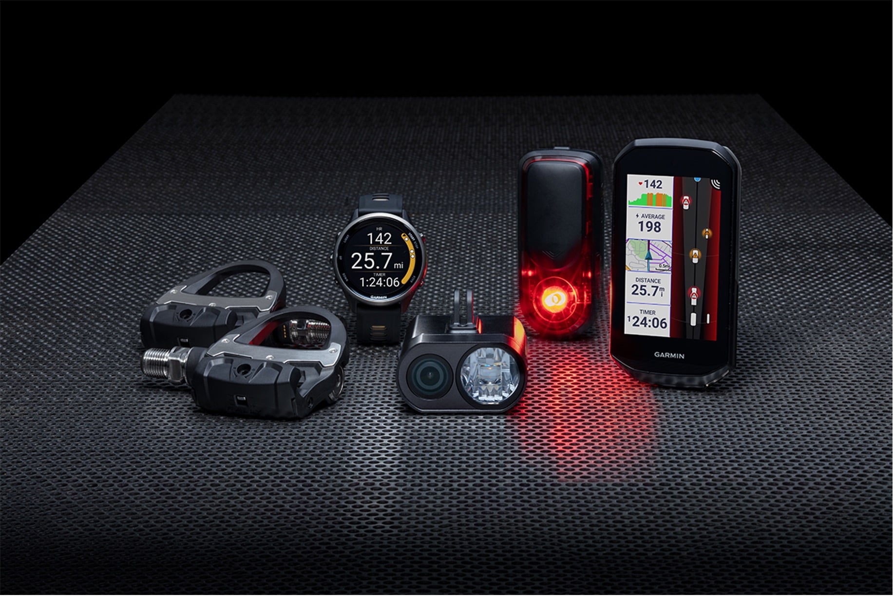 A line up of Garmin cycling products including an Edge cycling computer, rearview radar, power meters and more.